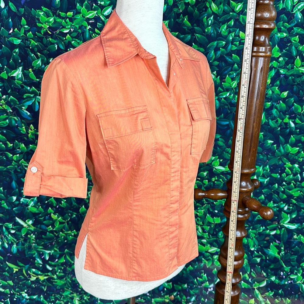 The color is a shimmering sunset, mixed w/straight lines & boxy femininity
